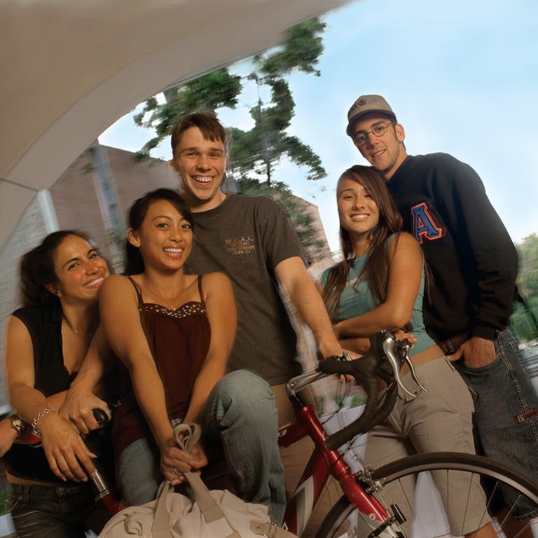 Students posing on bike