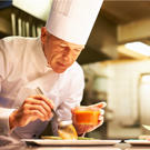 Chef Preparing a Meal on a Plate