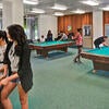 Students enjoy the game room at Aberdeen-Inverness residence hall.
