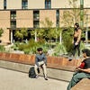 Students sit outside of Dundee Residence Hall.