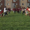 Students do a balloon toss game at the International Village.