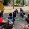 Students setting up a tent.